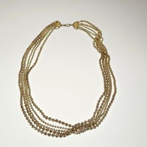Graduated multi-string necklace